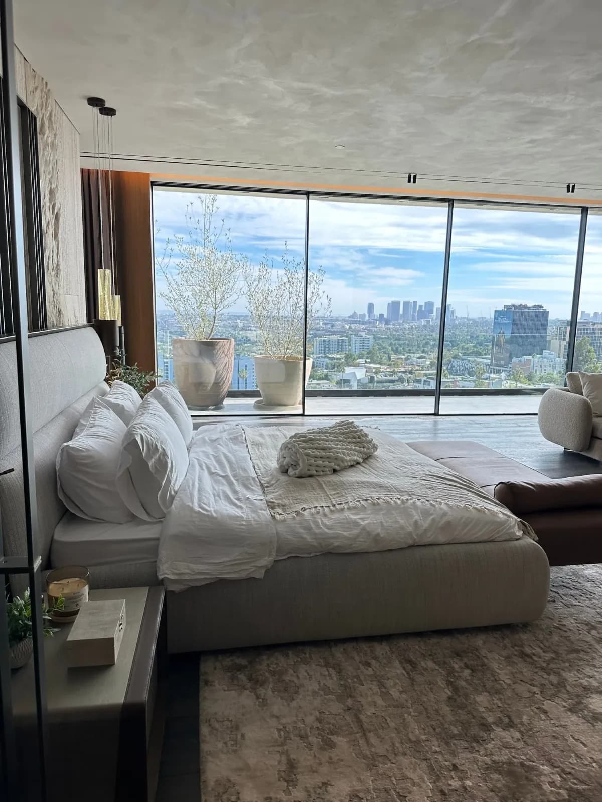 Elegant luxury Los Angeles bedroom with city views after professional cleaning