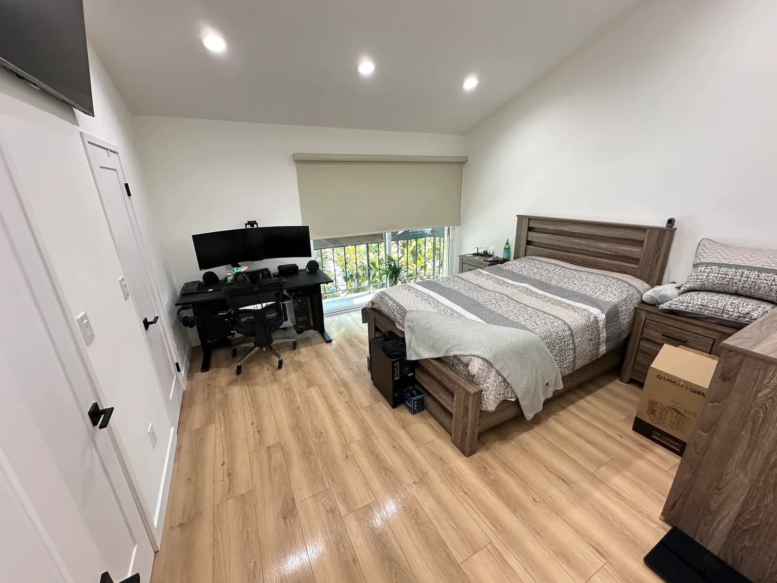 Organized bedroom with workspace after deep cleaning