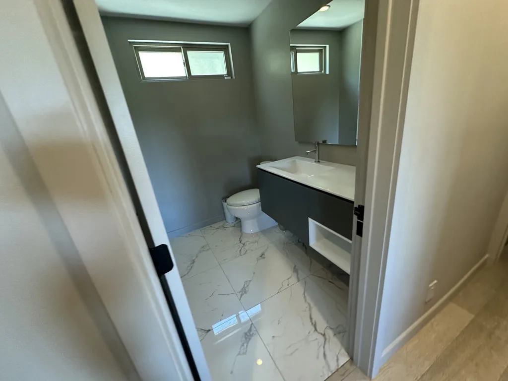 Contemporary bathroom with floating vanity after professional cleaning