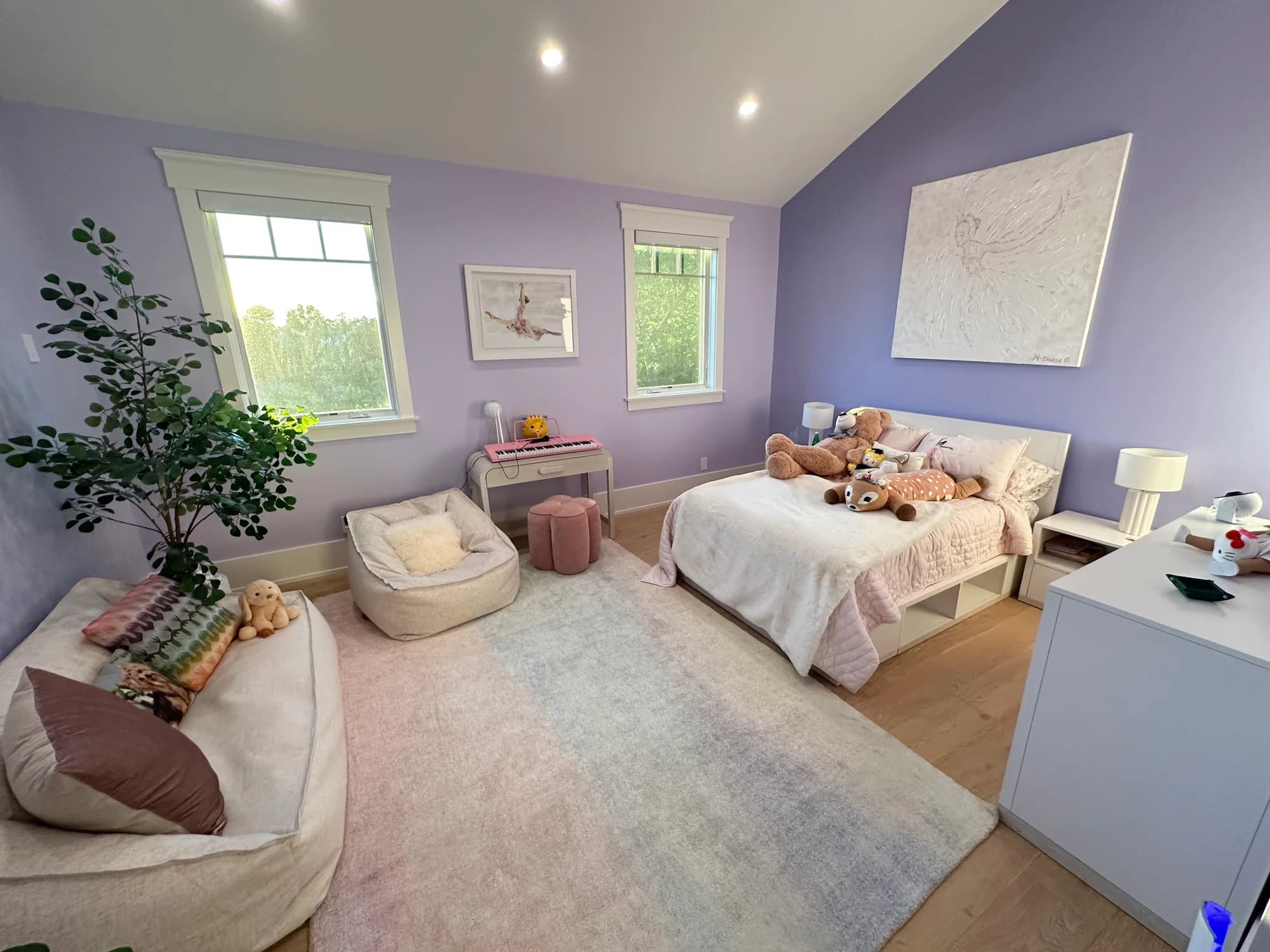 Children's bedroom with lavender walls, organized surfaces, and refreshed floors after residential cleaning