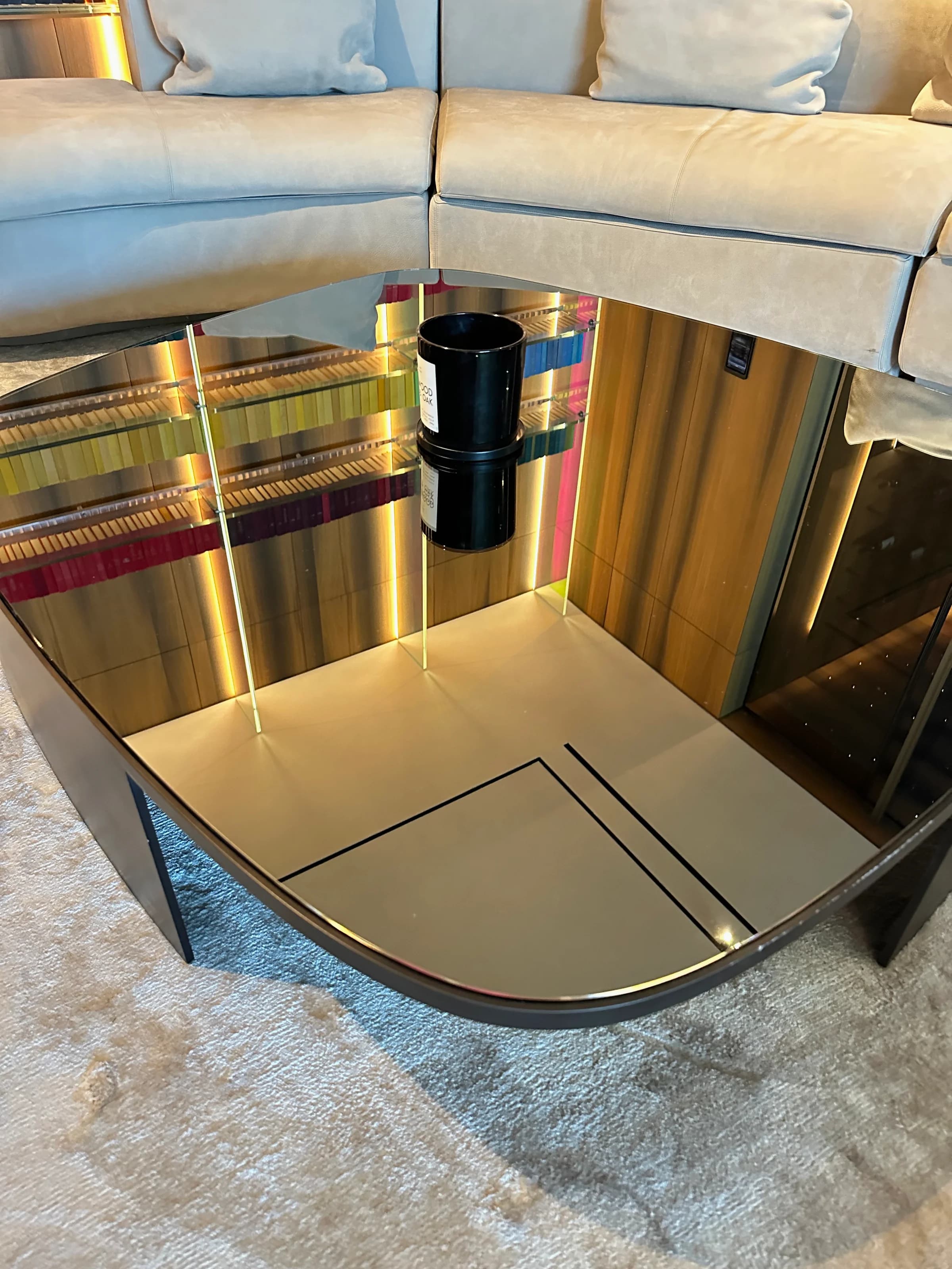 Contemporary design lounge with sectional seating, illuminated display, and meticulous finish work